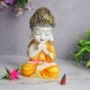Handicrafts Baby Buddha Showpiece Resin & Sandalwood Monk Figurine for Home & Living Room decor, Perfect Diwali Gift for Family & Friends (12X10X18cm, Orange)