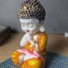 Handicrafts Baby Buddha Showpiece Resin & Sandalwood Monk Figurine for Home & Living Room decor, Perfect Diwali Gift for Family & Friends (12X10X18cm, Orange)