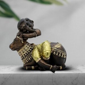 1-13-2.jpg Baby Ganesha Idol Resting on Cow Antique Finish Polyresin Ganpati Murti with Golden Dhoti for Home Decor, Pooja Room & Gift, 6 Inch