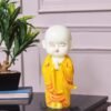 Meditating Buddha Monk Statue Decorative Baby Monk Doll Showpiece for Home Decor and Office (10 x 10 x 25 Centimeters) (Yellow)