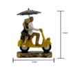 Romantic Couple Riding Yellow Scooter Statue - A Symbol of Love and Adventure