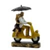 Romantic Couple Riding Yellow Scooter Statue - A Symbol of Love and Adventure