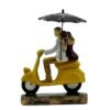 Romantic Couple Riding Yellow Scooter Statue - A Symbol of Love and Adventure