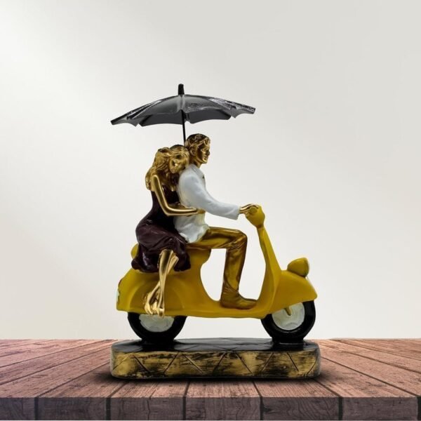 Romantic Couple Riding Yellow Scooter Statue - A Symbol of Love and Adventure